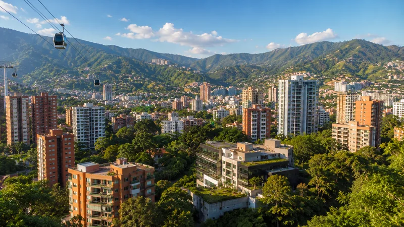 Medellín, Colombia — city skyline with cable cars and green mountains